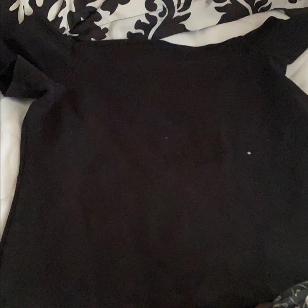 A black off shoulder shirt